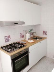 A kitchen or kitchenette at Antonella home b&b