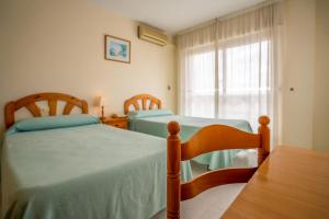 Postel nebo postele na pokoji v ubytování LOS NAREJOS Hotel