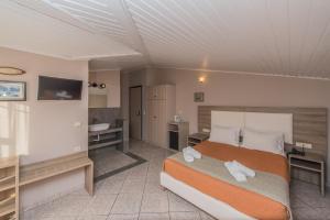 Postel nebo postele na pokoji v ubytování Planos Beach Hotel