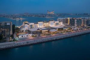 an aerial view of a city next to the water at Taj Exotica Resort & Spa, The Palm, Dubai in Dubai