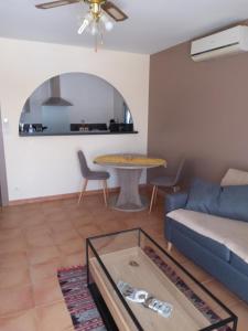 a living room with a couch and a table at Gite La RESTANCO in Mouriès
