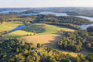 an aerial view of an island in a river at Gorgeous villa 10 acre of land in Menzies Creek