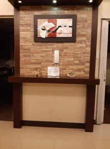 a counter in a room with a brick wall at Sarasota Residential Resort cluster 4 Unit 6C & 6L by Manny Newport Blvd, across NAIA T3 & near Resorts World Manila, Pasay City in Manila