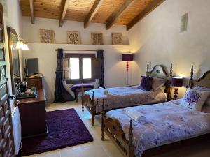 Postel nebo postele na pokoji v ubytování Grapevine Manor