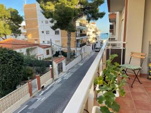 a balcony with a view of a city street at lovely apartment beside the Alcossebre beach in Alcossebre