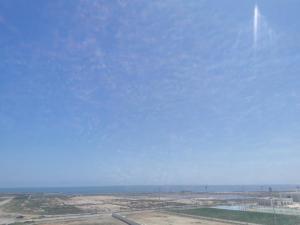 a view of an airport with a blue sky at Iquama atawhid I in Nador +9 photos