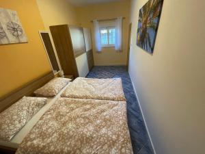 Posteľ alebo postele v izbe v ubytovaní Orangerie