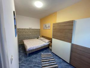 Postel nebo postele na pokoji v ubytování Orangerie