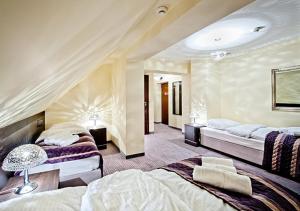 Postel nebo postele na pokoji v ubytování Hotel Willa Adriana
