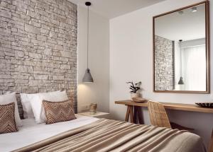 A bed or beds in a room at Windmill Bay Hotel
