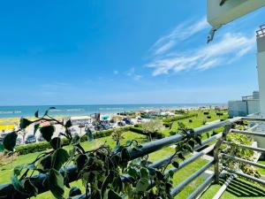 a view of the beach from the balcony of a condo at Al Mare Apartament in Fano