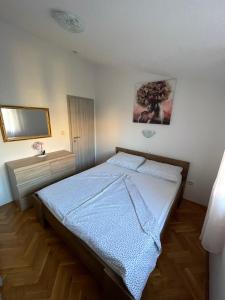 Postel nebo postele na pokoji v ubytování Orangerie