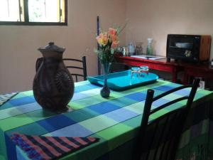 a table with a vase sitting on top of it at SUPERFINE Apartment in Galle