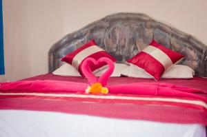Postel nebo postele na pokoji v ubytování Kabera Bungalow 1