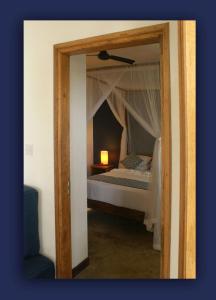 Postel nebo postele na pokoji v ubytování L'Hirondelle Self Catering Guest House