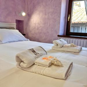 Кровать или кровати в номере La locanda dei fedeli di Vitorchiano