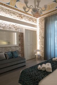 Postelja oz. postelje v sobi nastanitve Caportigia Boutique Hotel