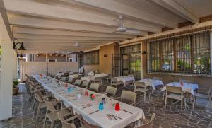 a row of tables and chairs in a restaurant at Hotel Gelmini in Verona