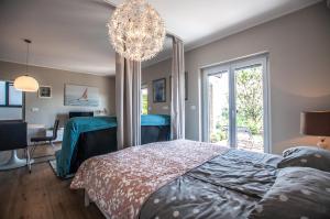 Postel nebo postele na pokoji v ubytování Sea View Apartments Debeli Rtič