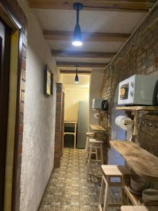 a room with a kitchen with a table and a counter at Hostel Danylo Halytskyi in Lviv