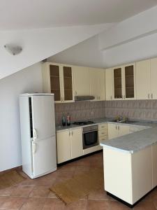 Kuchyň nebo kuchyňský kout v ubytování Apartmani Tomić + 5 fotografií