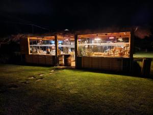 a food stand at night with lights in it at Agriturismo Sweet Cottage in Marina di Grosseto