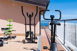 a row of exercise bikes on a balcony at Villa Teresa Bed & Breakfast Costa degli Dei in Pannaconi