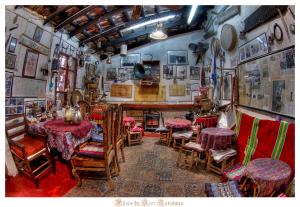 a dining room with tables and chairs and a table and chairs at Svarzman suite in Bat Shelomo