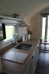 A kitchen or kitchenette at Strathy Bay Pods