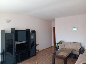 a living room with a couch and a table at Guest House Diamant in Sozopol