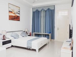 Ένα ή περισσότερα κρεβάτια σε δωμάτιο στο Fiyala Homestay