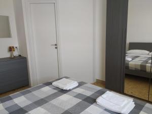 Postel nebo postele na pokoji v ubytování La Terrazza su Monza Casa Vacanze