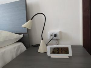 Postel nebo postele na pokoji v ubytování La Terrazza su Monza Casa Vacanze