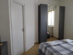 Postel nebo postele na pokoji v ubytování La Terrazza su Monza Casa Vacanze