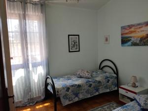 A bed or beds in a room at Villa dei Ginepri