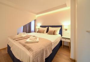 Postel nebo postele na pokoji v ubytování Apartments Adria Danka
