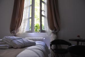 Postel nebo postele na pokoji v ubytování Ida Chambres d'hôtes B&B