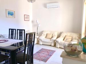 a living room with a couch and a table at Relax Maratea in Maratea