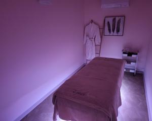 A bed or beds in a room at Hôtel Causse Comtal Rodez, The Originals Relais