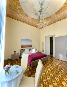 Postel nebo postele na pokoji v ubytování Armonia B&B