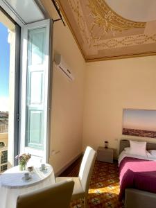 Postel nebo postele na pokoji v ubytování Armonia B&B