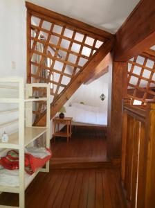a attic room with a bunk bed and a ladder at 6COMA5 Appartement proche centre ville et plage in Collioure