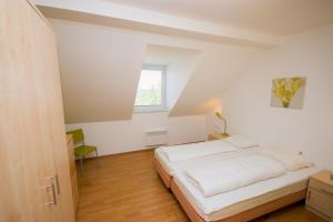 Postel nebo postele na pokoji v ubytování Villapark Lipno Dreams - pet friendly