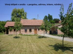 a brick building with a yard in front of it at Dj-penzion in Vracov