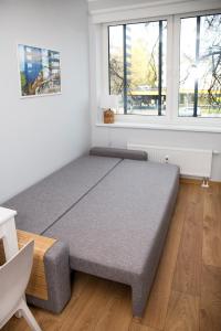a large bed in a room with a window at Pepleri Studio 7 in Tartu