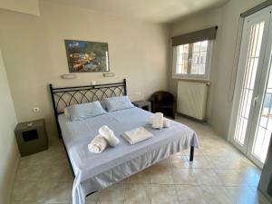 Posteľ alebo postele v izbe v ubytovaní Pelagias Apartments