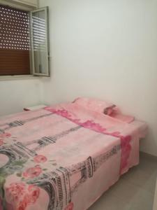 A bed or beds in a room at Alexia