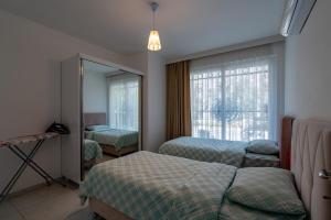Ένα ή περισσότερα κρεβάτια σε δωμάτιο στο Sare Suites Downtown