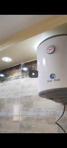 a white toaster sitting on top of a room at شقه 115متر سوبر لوكس العامريه قريبه من الاسكندريه10min from Alexanderia in ‘Izbat al Musta‘marah