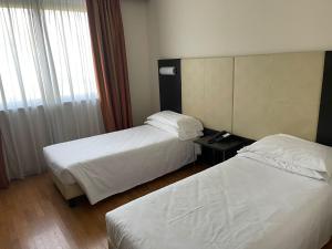 Cama o camas de una habitación en Elysium Hotel Raya